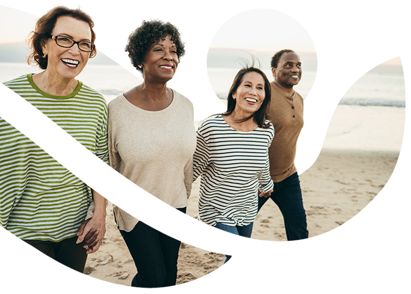 Group of people smiling and walking on the beach with AmeriBen logo overlay